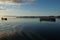 Sunset on the Columbia river connecting port of Portland, Oregon, USA with Pacific Ocean with anchored ships under the blue sky.