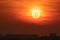 Sunset with crypto currency Bitcoin symbol on the Sun. Falling currency concept.