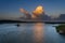 Sunset cumulus clouds on tropical horizon.