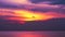 Sunset dark purple on red cloud moving down on sea and orange sky background