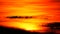 Sunset on dark red cloud and orange sky and silhouette airplane flying pass sun time lapse