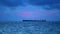 Sunset dark sky red storm cloud moving on sea and silhouette cargo ship wave on water