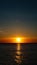 Sunset or dawn at sea. Black Sea shore. Mobile Screensaver, Vertical Layout, Nature Wallpaper. Beautiful Colors, Marine Theme