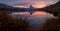 Sunset on dem Matterhorn and its reflection in a mountain lake