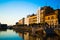 Sunset in the dock of Gijon, Asturias, Spain, with the reflections of the buildings in the water. Relaxing place