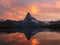Sunset with dramatic alpenglow at the high mountain lake Stelisee with Matterhorn