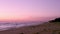 Sunset at Dunas Douradas beach seascape, destination in Algarve, Portugal.