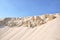 Sunset dunes and blue skies background