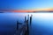 Sunset at dusk along a wooden pier