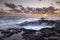 Sunset at El Bufadero natural blowhole on Gran Canaria. Ocean waves hiting rocks