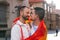 Sunset Embrace: Gay Friends Celebrating Love and Pride in Vibrant City Streets