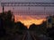 Sunset at empty abandoned train tracks leading into the distant vanishing point in Pripyat