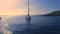 Sunset in an empty Greek marina, Methana, Mediterranean Sea. Aero video shooting, A lone sailing yacht comes into the