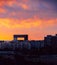 Sunset facade of the apartment building Edificio Mirador, a postmodern architecture building with a central opening with