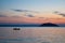 Sunset, fisherman on his boat