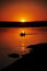 Sunset fisherman silhouettes