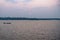 Sunset with fishing boat at the Ashtamudi Lake, Kollam, Kerala, India