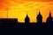 Sunset forming a silhouette of St. Paul, London Bridge and double deckers