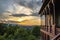 Sunset on the front porch of a house