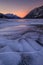 Sunset on a frozen lake in Kananaskis Country in the Canadian Rocky Mountains, Albeta