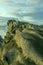 Sunset on the Galician coast of the lower estuaries next to large breakwaters of granodiorite rocks one afternoon with clouds