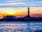 Sunset at Genoa`s port, silhouette of the Lanterna, Italy