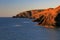 Sunset glow highlighting the rock strata in cliffs