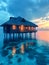 Sunset Glow on Tropical Overwater Villa.Overwater bungalow bathed in the warm glow of a tropical sunset