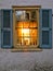 Sunset Glowing Through an Old House Window