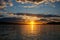 Sunset With God Rays Over Smooth Lake Powell Water During Golden Hour