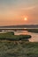 Sunset in grassland wetland along the sound