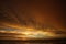 Sunset after heavy rain with arcus shelf storm clouds and stones in the ocean on tropical island Ko Lanta, Thailand