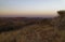 Sunset from a hill looking down over the hills and plains below at the Madikwe Game Reserve