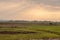 Sunset on the hills and a bed of palm trees in the Amboseli in K