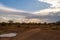 Sunset on the hills and a bed of palm trees in the Amboseli in K