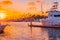 Sunset hits the Oceanside Harbor and glows on boats and water