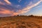 Sunset on the horizon over a vast landscape