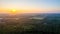 Sunset Horizon Over Verdant Forest