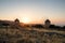 Sunset hour with two silhouettes of old windmills. Crete island