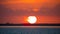Sunset. Huge sun. Beautiful seascape. Red sky with clouds. Ocean or Gulf of Mexico. Summer vacation. Sundown Horizon Panorama