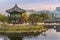 Sunset Hyangwonjeong Pavilion in Gyeongbokgung Palace with Autumn season and cityscape