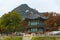 Sunset Hyangwonjeong Pavilion in Gyeongbokgung Palace with Autumn season and mountain