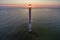 Sunset illuminating the tilted Kiipsaare lighhouse in Estonia