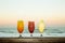 A sunset image showing mixed drinks lined up