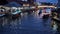 A sunset at Khlong Lat Mayom Floating Market with boat in a water canal