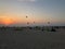Sunset at kite beach Dubai UAE full of colorful kites