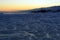 Sunset on lake Baikal. Frozen waves