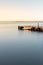 Sunset on a lake with an empty jetty and feeling of calm