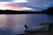 Sunset on the lake with fishing boat on the shore in Finland