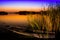 Sunset on the lake with old boat wreck